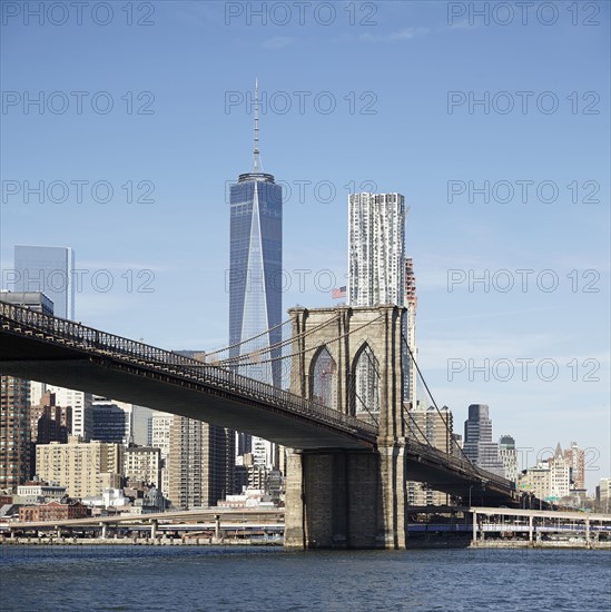 View of suspension bridge and cityscape