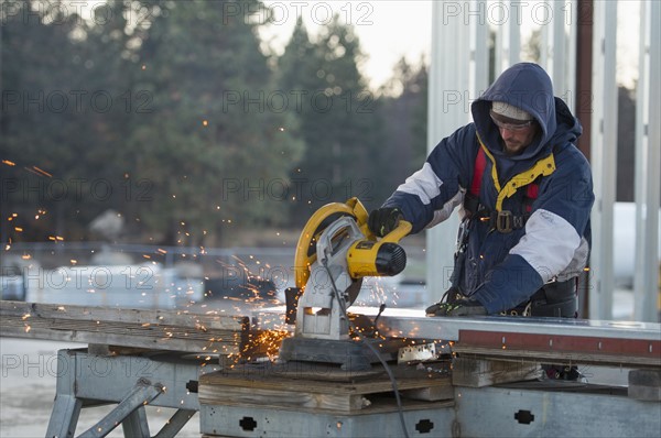 Man cutting steel bar