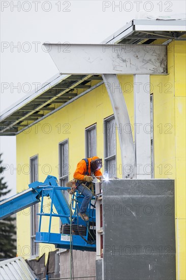 Men welding steel bar