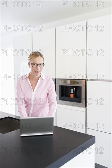 Woman using on laptop at home