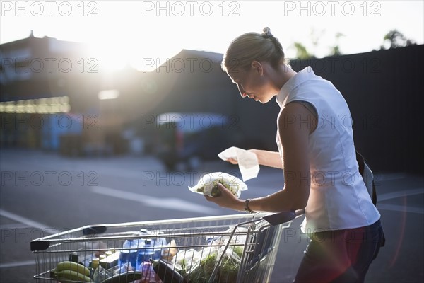 Woman checking shopping