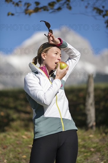 Woman eating apple