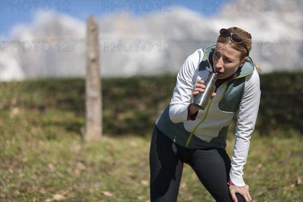 Woman drinking from bottle