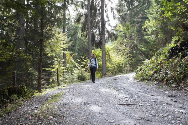 Woman hiking in forest