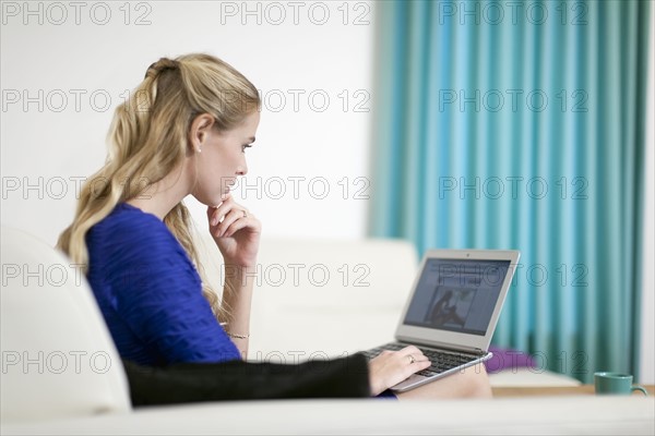 Young woman using laptop