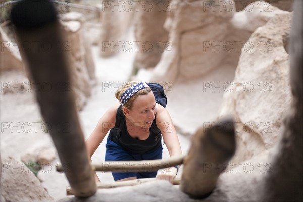 Woman walking up ladder