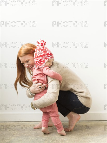 Mother embracing baby son (2-3)