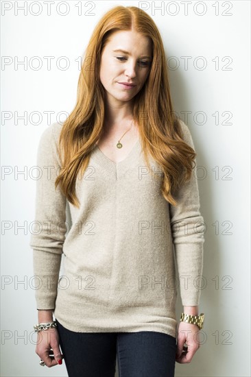 Portrait of woman with long red hair