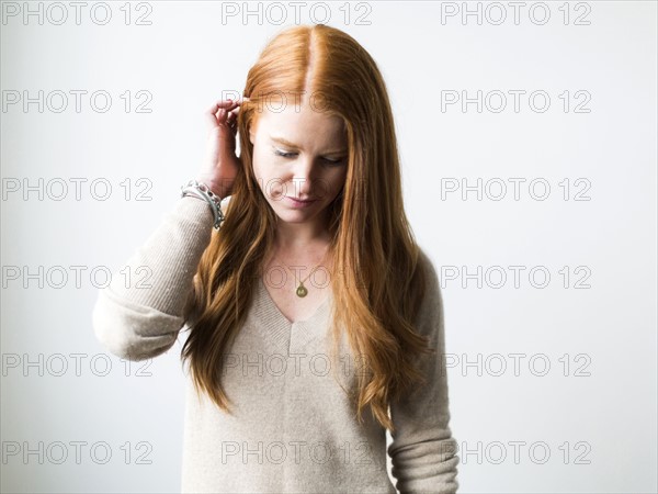 Portrait of woman with long red hair