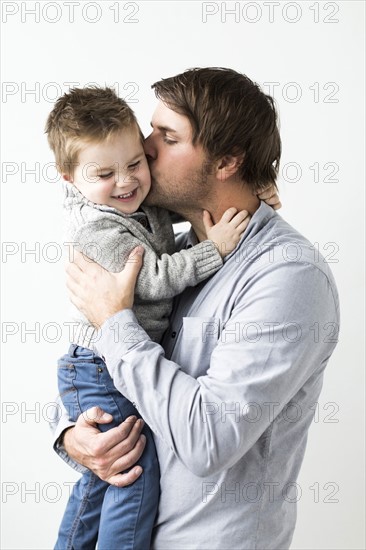 Father kissing son (2-3)