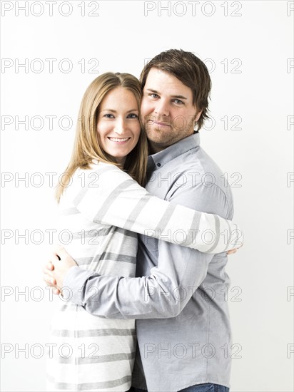 Mid-adult couple embracing