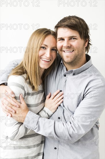 Mid-adult couple embracing