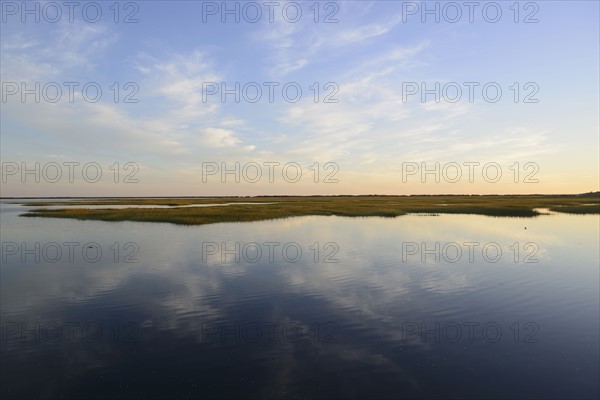 Sky reflecting in still bay