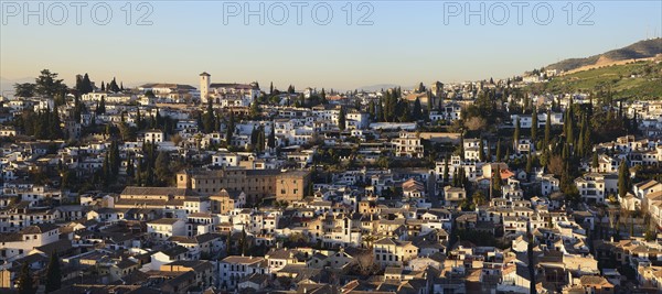 Townscape and hill in sunlight