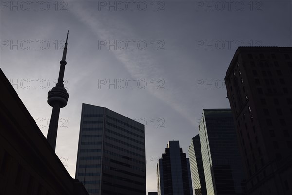 Low angle view of city architecture and communications tower