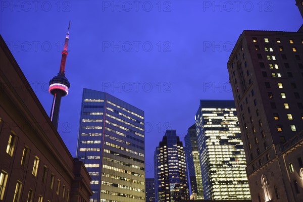 Illuminated city at dusk and CN Tower