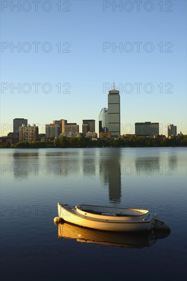 Boat on river with skyline in background