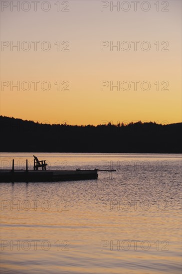 Jetty on lake at dawn
