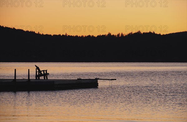 Jetty on lake at dawn