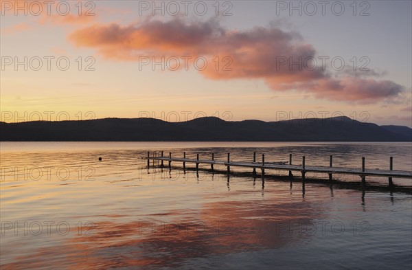 Jetty on lake at dawn