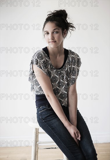 Portrait of teenage girl (14-15) in studio.