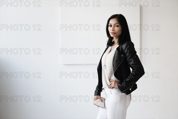 Portrait of young woman in studio.