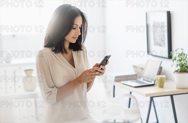 Woman using smart phone.