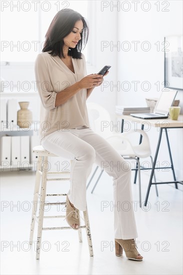 Woman using smart phone.