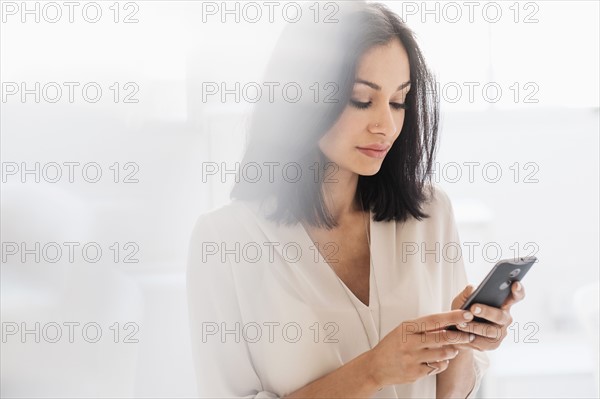 Woman using smart phone.