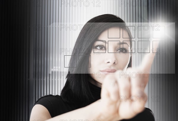 Woman touching screen button.