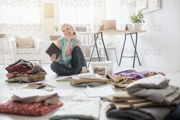 Design professional working in living room.