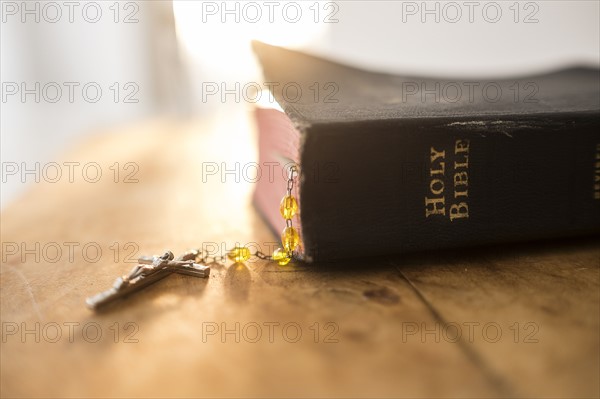 View of Bible and rosary beads.