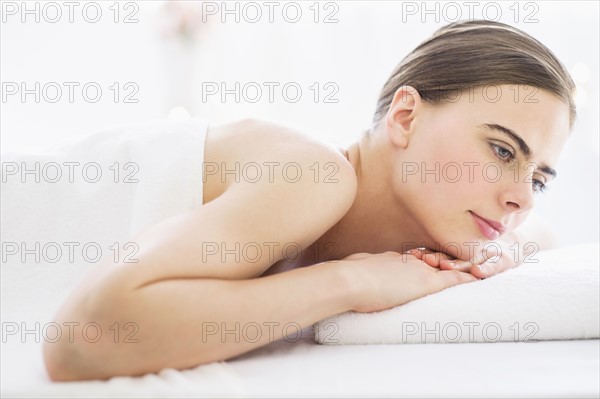 Young woman relaxing in spa.