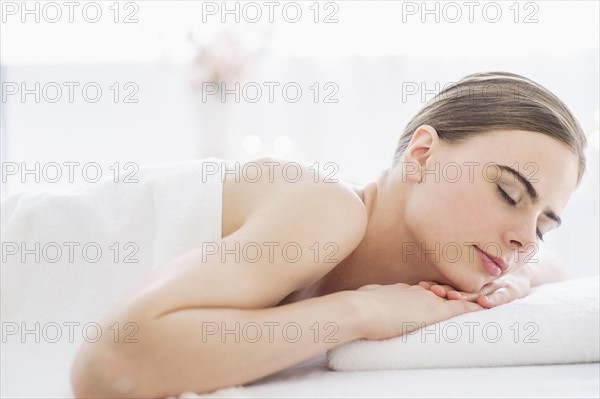 Young woman relaxing in spa.