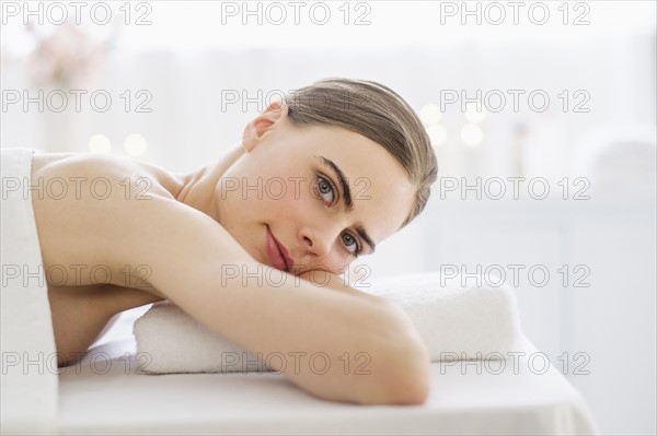 Young woman relaxing in spa.