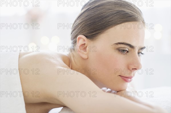 Young woman relaxing in spa.