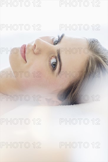 Portrait of young woman during beauty treatment.