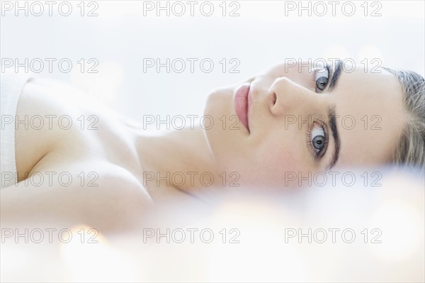 Portrait of young woman during beauty treatment.