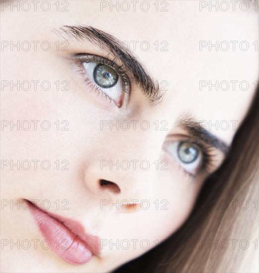 Portrait of young woman with blue eyes.