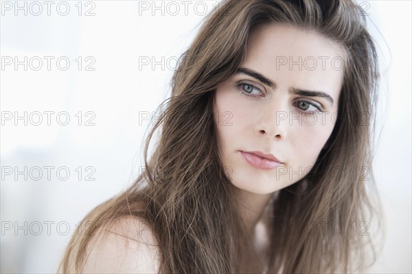 Portrait of young woman with blue eyes.