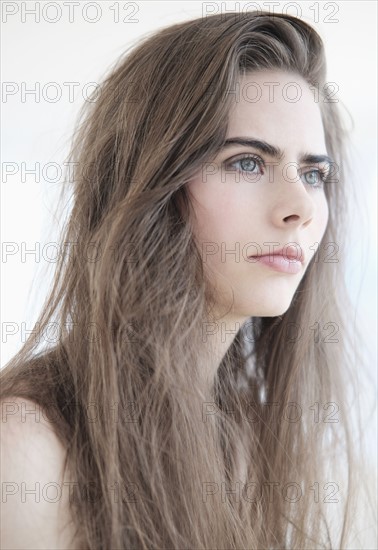 Portrait of young woman with blue eyes.