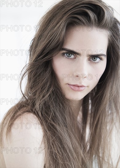 Portrait of young woman with blue eyes.