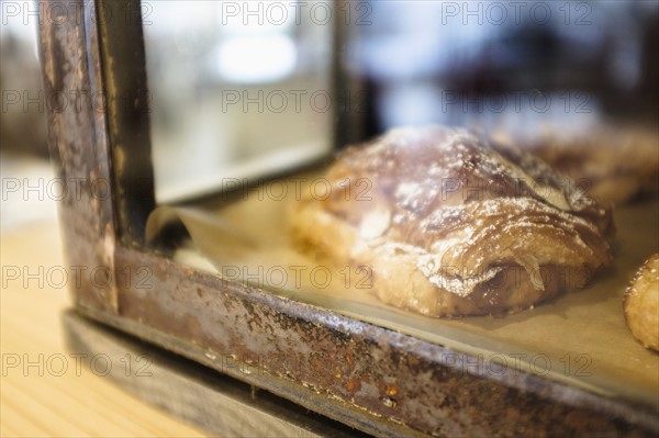 Close-up of croissant in bakery.