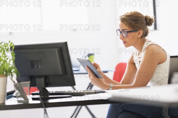 Young woman working in office.