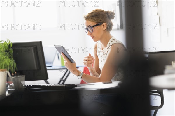 Young woman working in office.