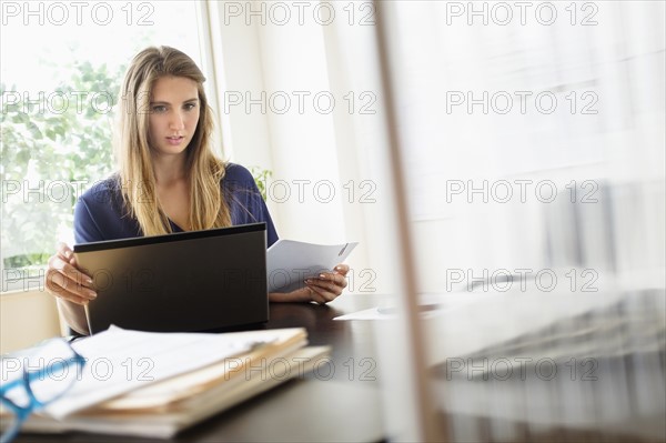 Woman working in office.