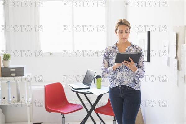 Young woman working in office.