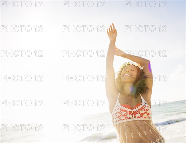 Young woman smiling on beach