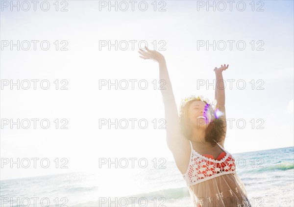 Young woman smiling on beach