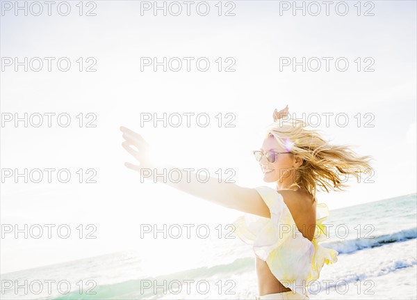 Young woman smiling on beach